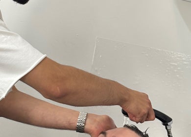 Hair rinse service at TIMI J BARBERS in Paisley, Scotland, GB, enhancing relaxation and care.