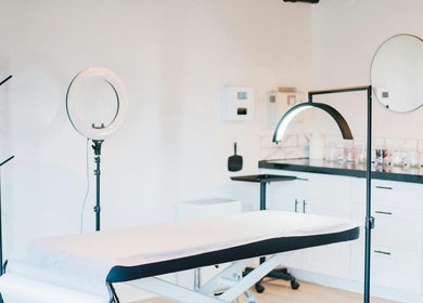 Treatment room at Relive Spa, Al Rayyan, Doha showcasing a modern massage table and elegant decor.