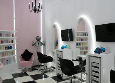 Chic interior of Relive Spa, Al rayyan, Doha Municipality, QA with styling chairs and product shelves.