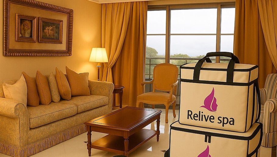 Elegant lounge area at Relive Spa ريلايب اسفا in Al Rayyan, Doha Municipality, QA with warm decor and spa bags.
