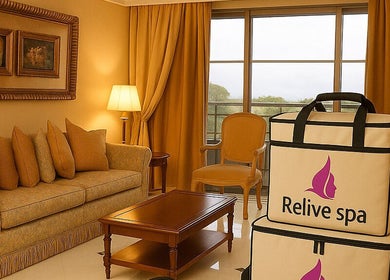 Elegant lounge area at Relive Spa ريلايب اسفا in Al Rayyan, Doha Municipality, QA with warm decor and spa bags.