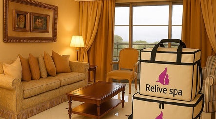 Elegant lounge area at Relive Spa ريلايب اسفا in Al Rayyan, Doha Municipality, QA with warm decor and spa bags.