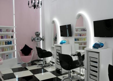 Sleek salon interior at Relive Spa ريلايب اسفا, Al rayyan, Doha Municipality, QA, showcasing modern styling chairs.