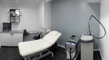 Calm treatment room at Elite Skin Clinic, Altrincham, England, GB, featuring modern equipment and stylish decor.