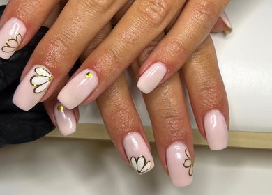 Detailed nail art with gold accents at Nailsbybry, Ampthill, England, GB showcases intricate floral designs.