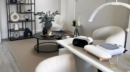 Modern interior of Nailsbybry in Ampthill, England, GB featuring a stylish manicure station and elegant decor.