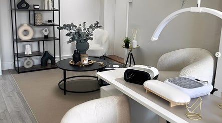 Elegant interior of Nailsbybry in Ampthill, England, GB with modern decor and nail station setup.