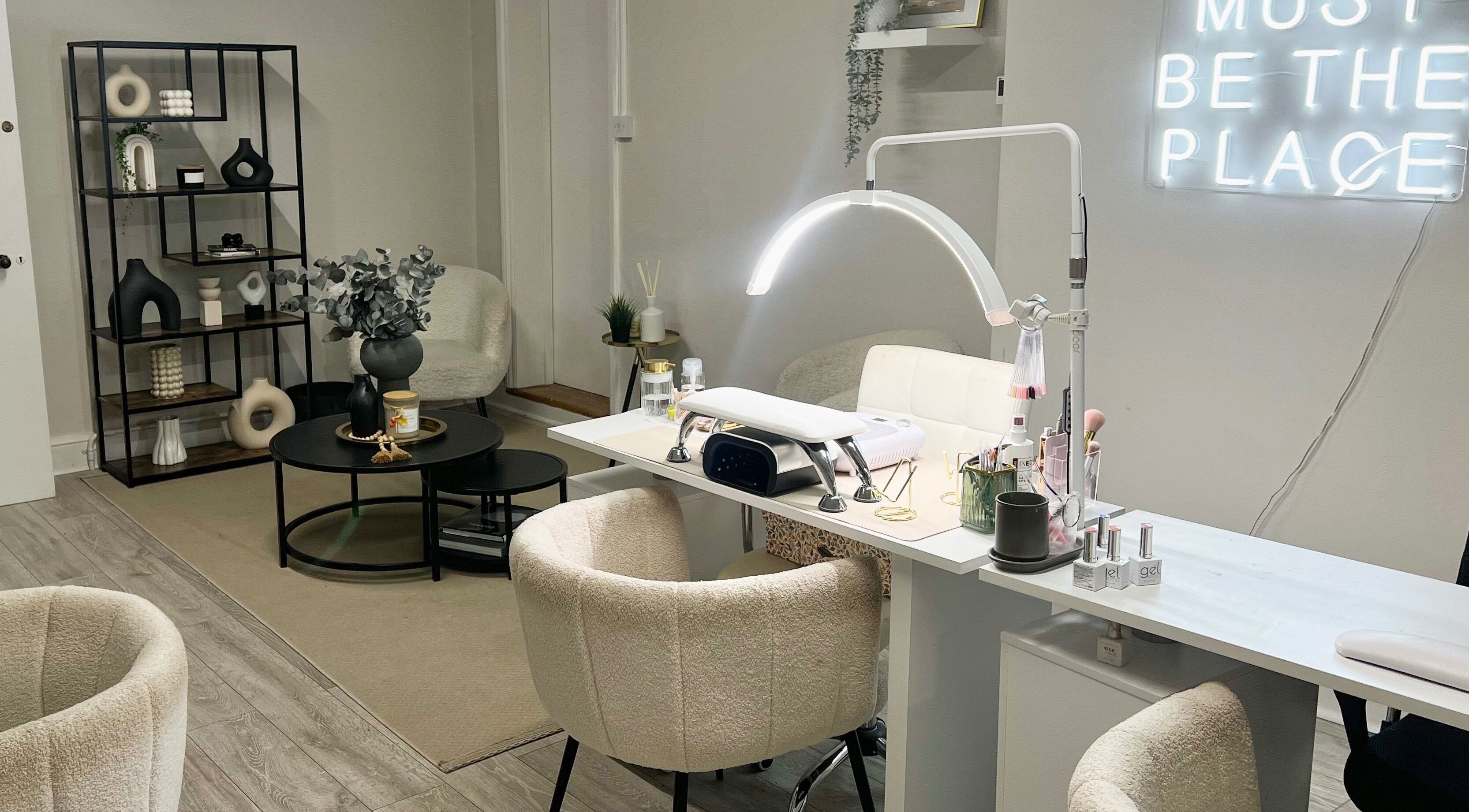 Modern nail salon interior at Nailsbybry, Ampthill, England, GB with elegant decor and cozy seating.