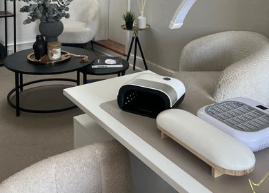 Modern manicure station at Nailsbybry, Ampthill, England, GB. Cozy seating and stylish nail equipment.
