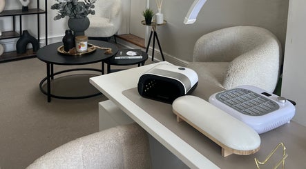 Modern manicure station at Nailsbybry, Ampthill, England, GB. Cozy seating and stylish nail equipment.