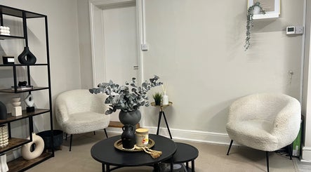 Elegant waiting area at Nailsbybry, Ampthill, England, GB with modern chairs and stylish decor.