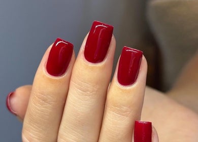 Elegant red manicure at Nailsbybry, Ampthill, England, GB, showcasing stunning nail artistry.