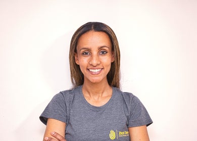 Smiling staff member at Zizzi Zemro Functional Massage, Bradford-on-Avon, England, GB.