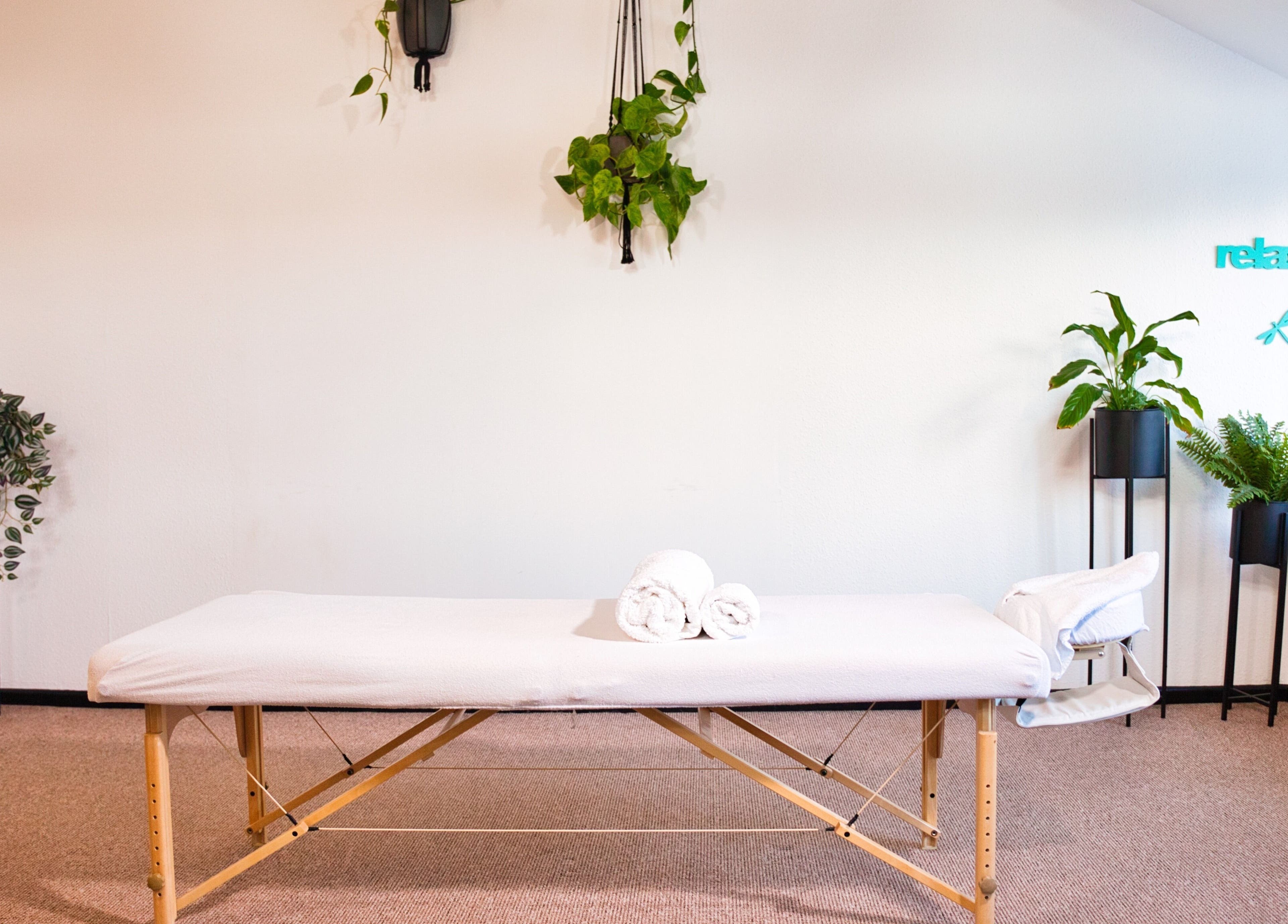 Cozy massage room with plants at Zizzi Zemro Functional Massage, Bradford-on-avon, England, GB.