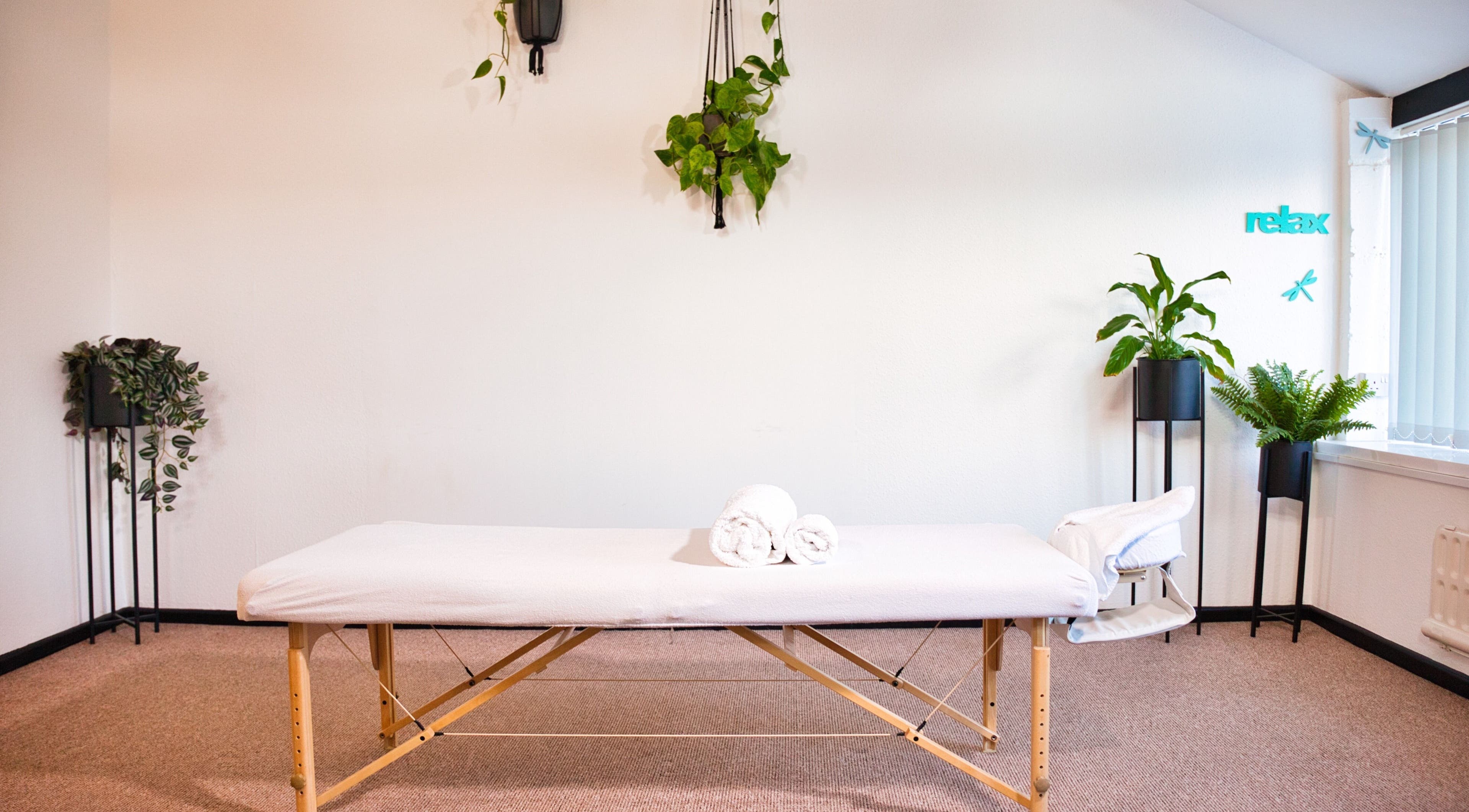 Cozy massage room with plants at Zizzi Zemro Functional Massage, Bradford-on-avon, England, GB.