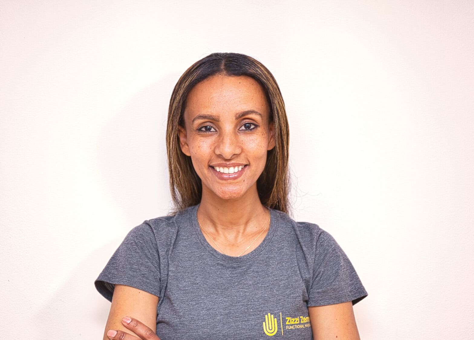 Massage therapist at Zizzi Zemro Functional Massage, Bradford-on-Avon, England, GB, smiling warmly.