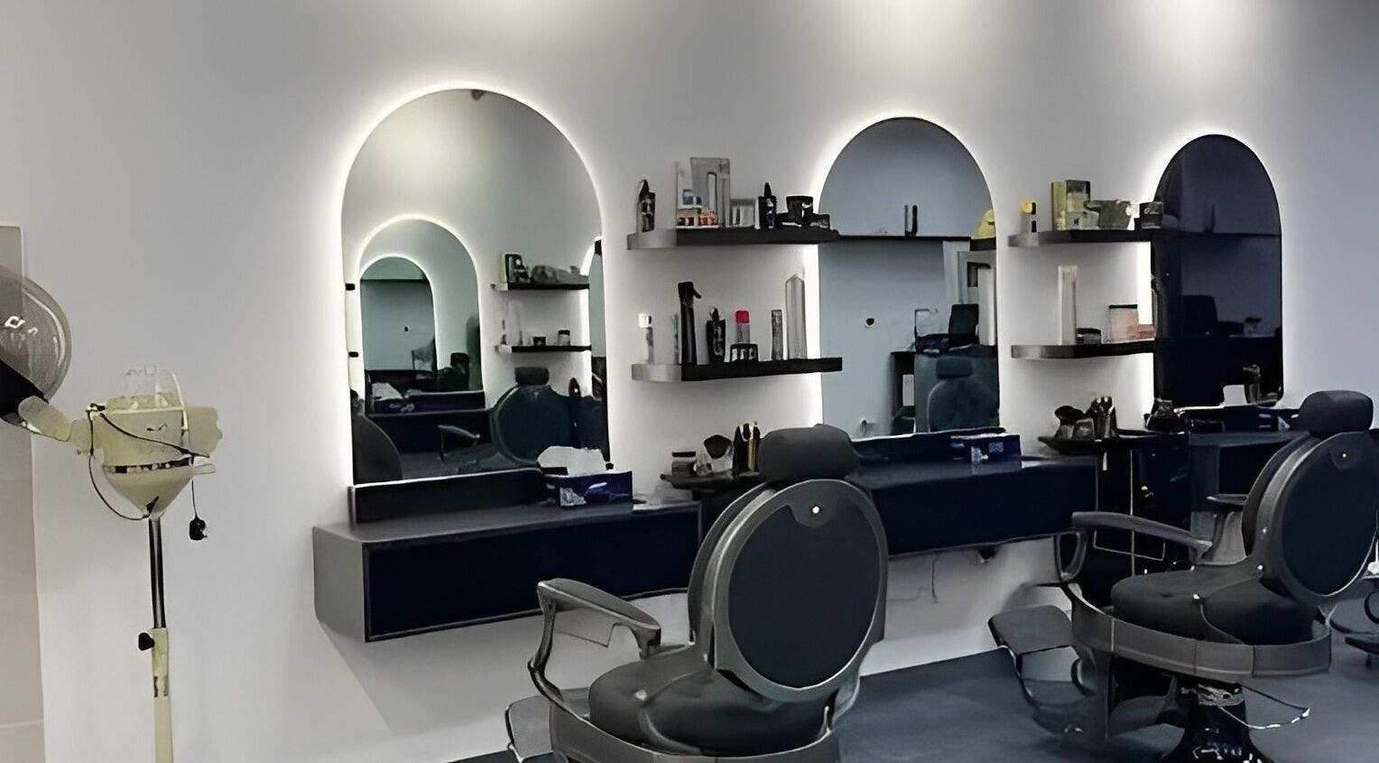 Modern interior of Razor Kings Salon L.L.C, Dubai, Dubai, AE featuring stylish barber chairs and mirrors.