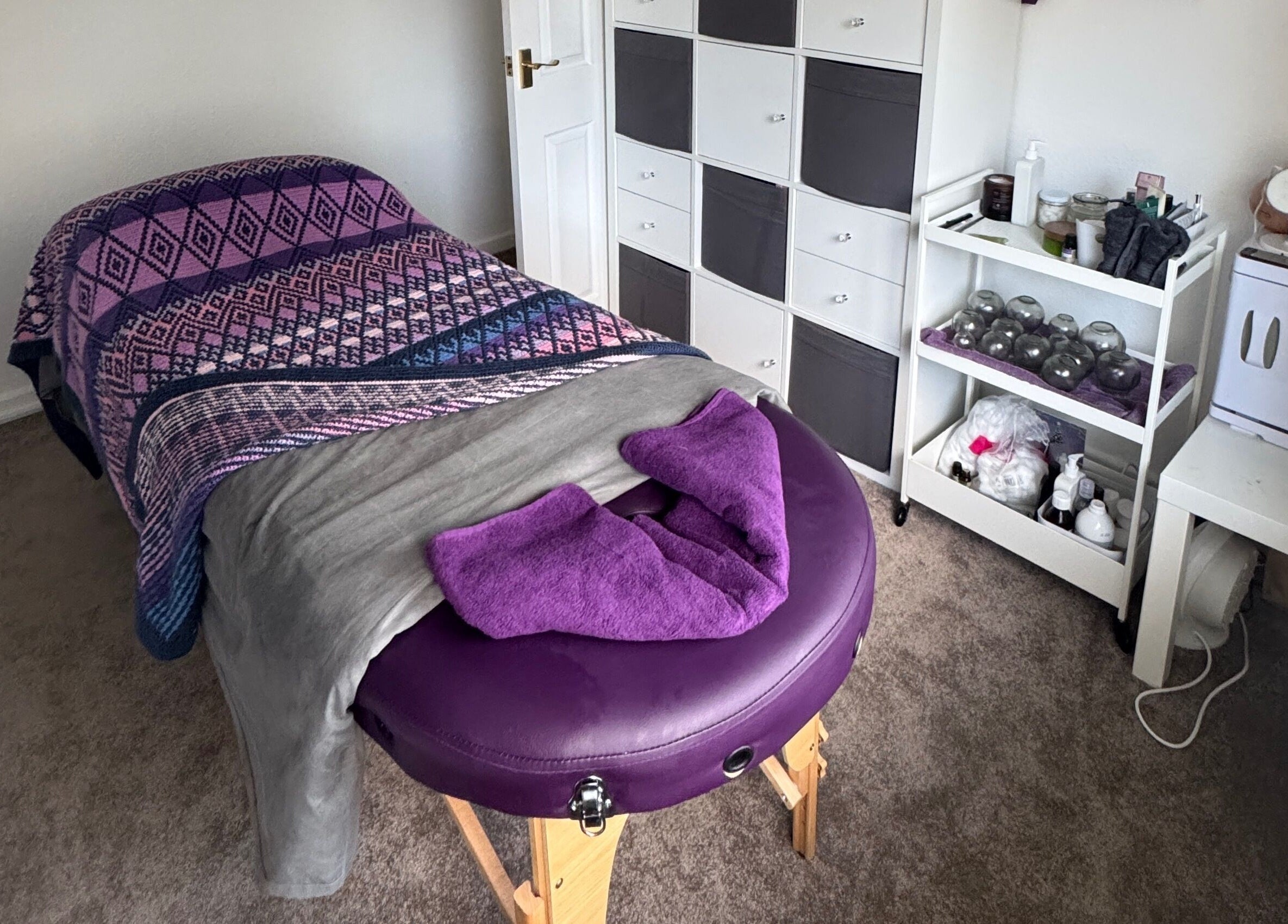 Relaxing massage room at Massage By Ultra in East Grinstead, England, GB, featuring a cozy massage table.