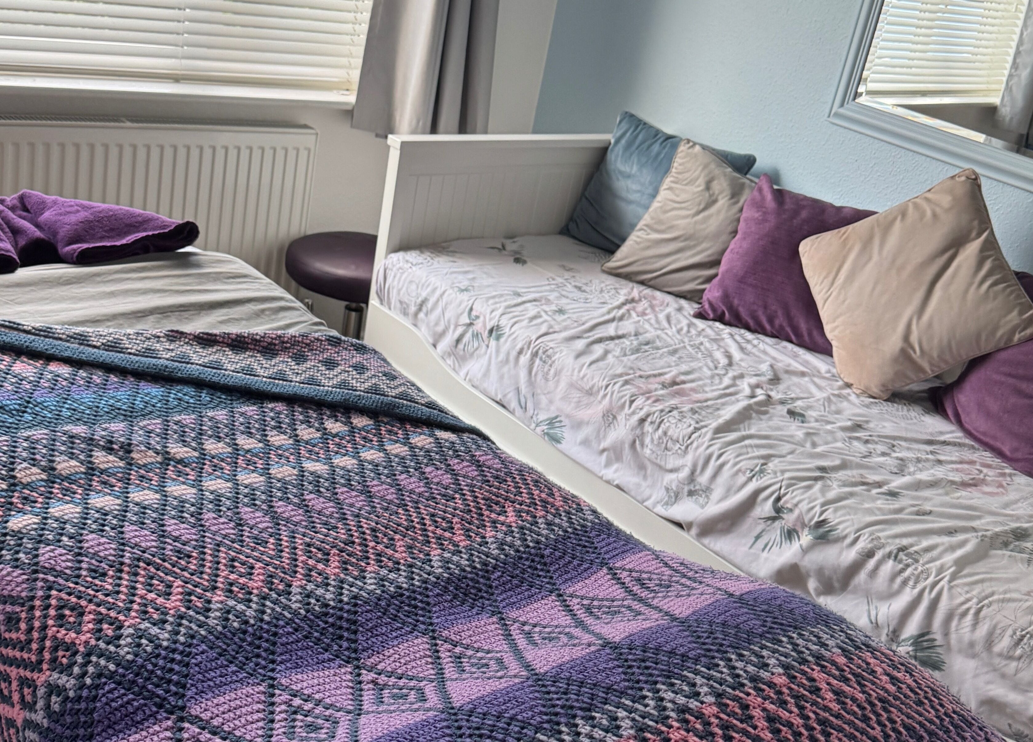 Relaxing massage setup at Massage By Ultra, East Grinstead, England, GB with plush bed and pillows.