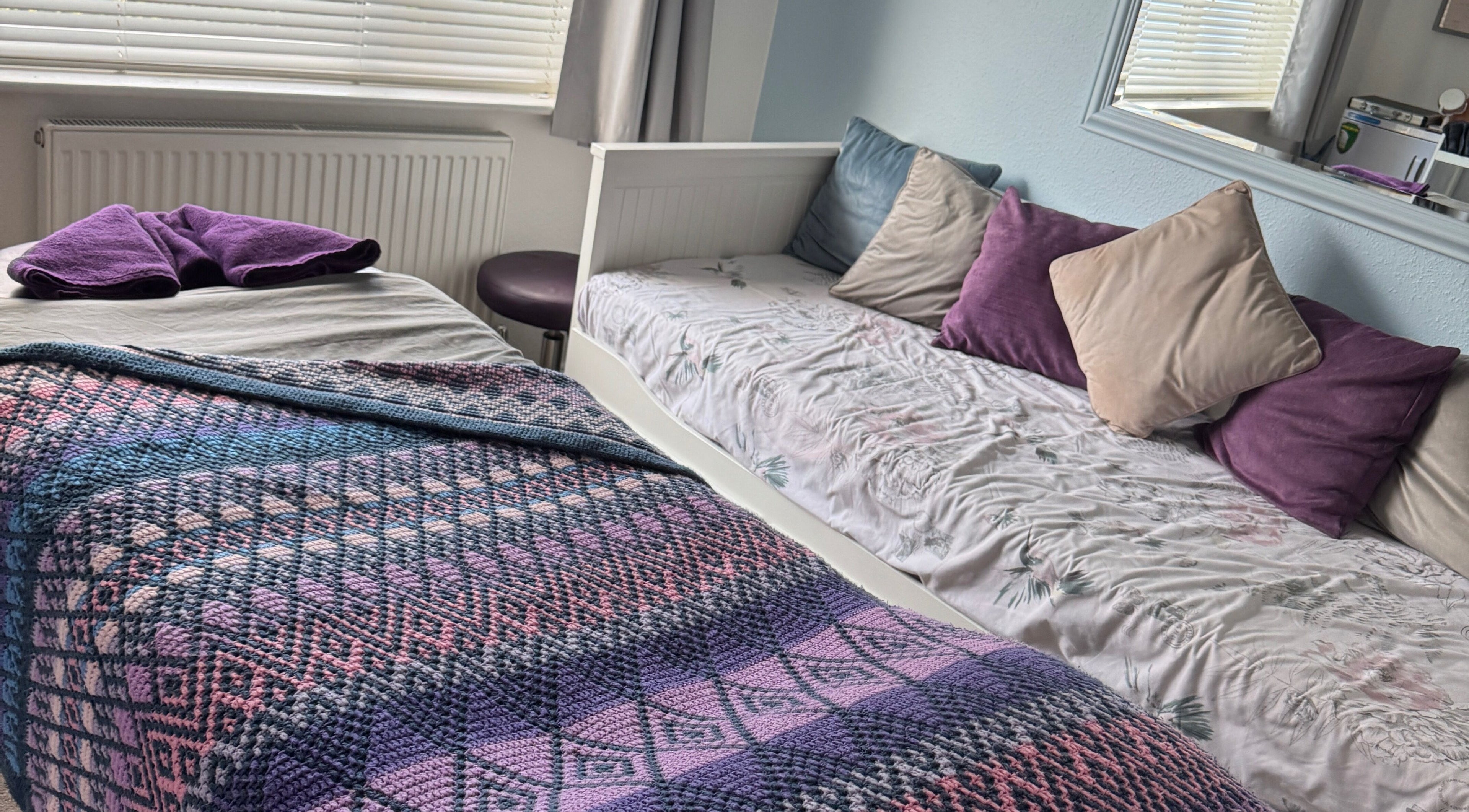 Relaxing massage setup at Massage By Ultra, East Grinstead, England, GB with plush bed and pillows.