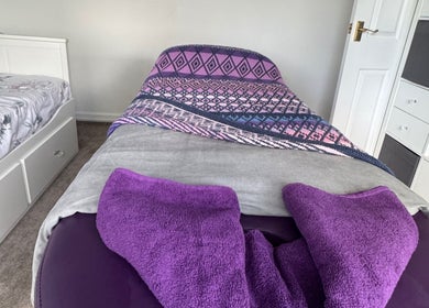 Peaceful massage room at Massage By Ultra, East Grinstead, England, GB, featuring a cozy bed and soothing decor.