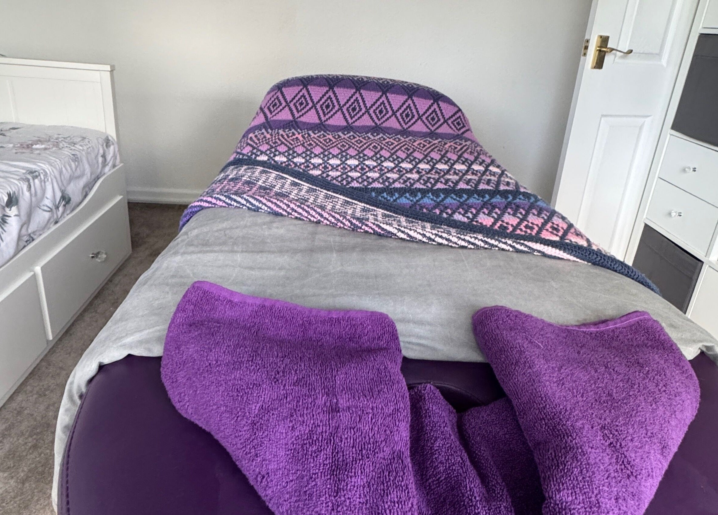 Peaceful massage room at Massage By Ultra, East Grinstead, England, GB, featuring a cozy bed and soothing decor.