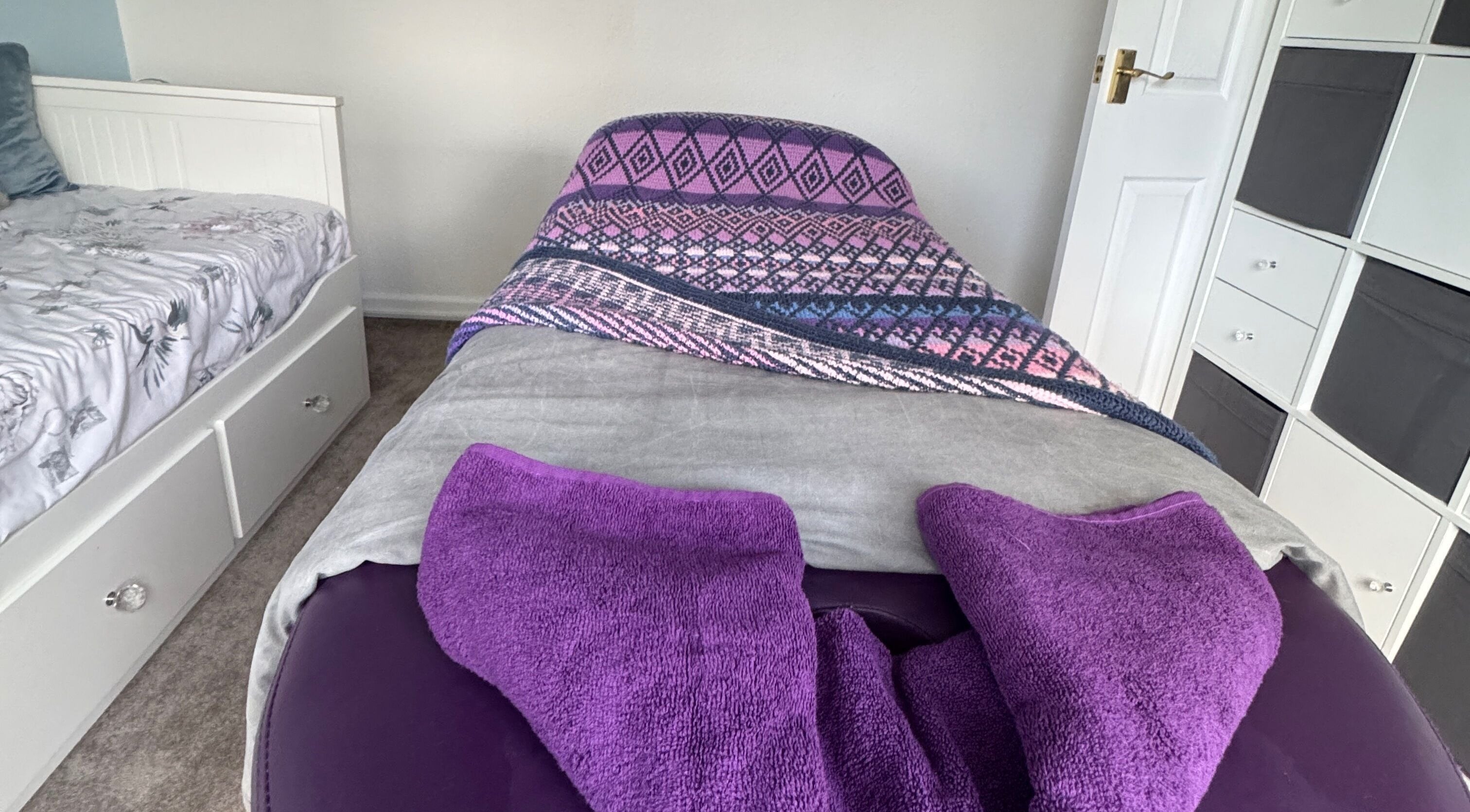 Peaceful massage room at Massage By Ultra, East Grinstead, England, GB, featuring a cozy bed and soothing decor.