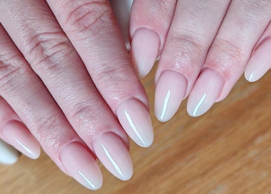 Elegant manicured nails at Sunshine Nail Studio, Raunds, England, GB, showcasing a glossy nude finish.