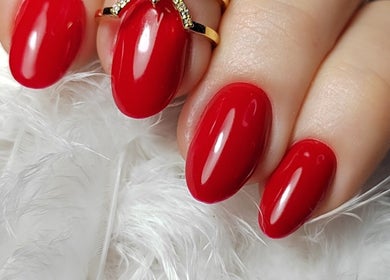 Vibrant red manicure at Sunshine Nail Studio, Raunds, England, GB, enhancing elegance and style.