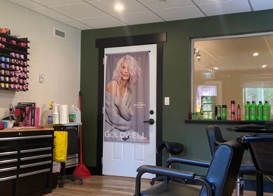 Modern salon interior at Sacred Beauty, Canal Flats, BC, CA, featuring vibrant hair products and styling chairs.