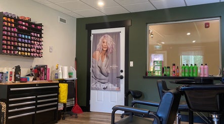 Modern salon interior at Sacred Beauty, Canal Flats, BC, CA, featuring vibrant hair products and styling chairs.