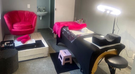The Beauty Pond's serene spa room in Cape Town, Western Cape, ZA with rich pink accents.