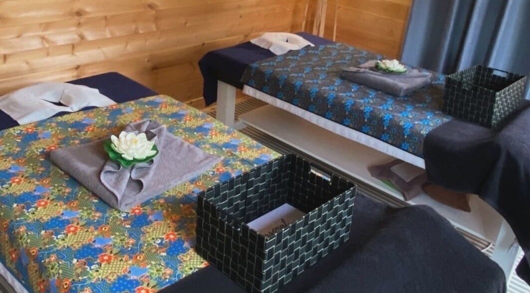 Massage beds with floral decor at Massage Loft (Drury), Auckland, Auckland, NZ. Relaxation awaits.