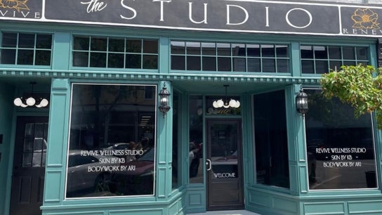Entrance to Beauty Ink @RevIVe Wellness Studio in Seymour, Indiana, US, featuring elegant teal facade.
