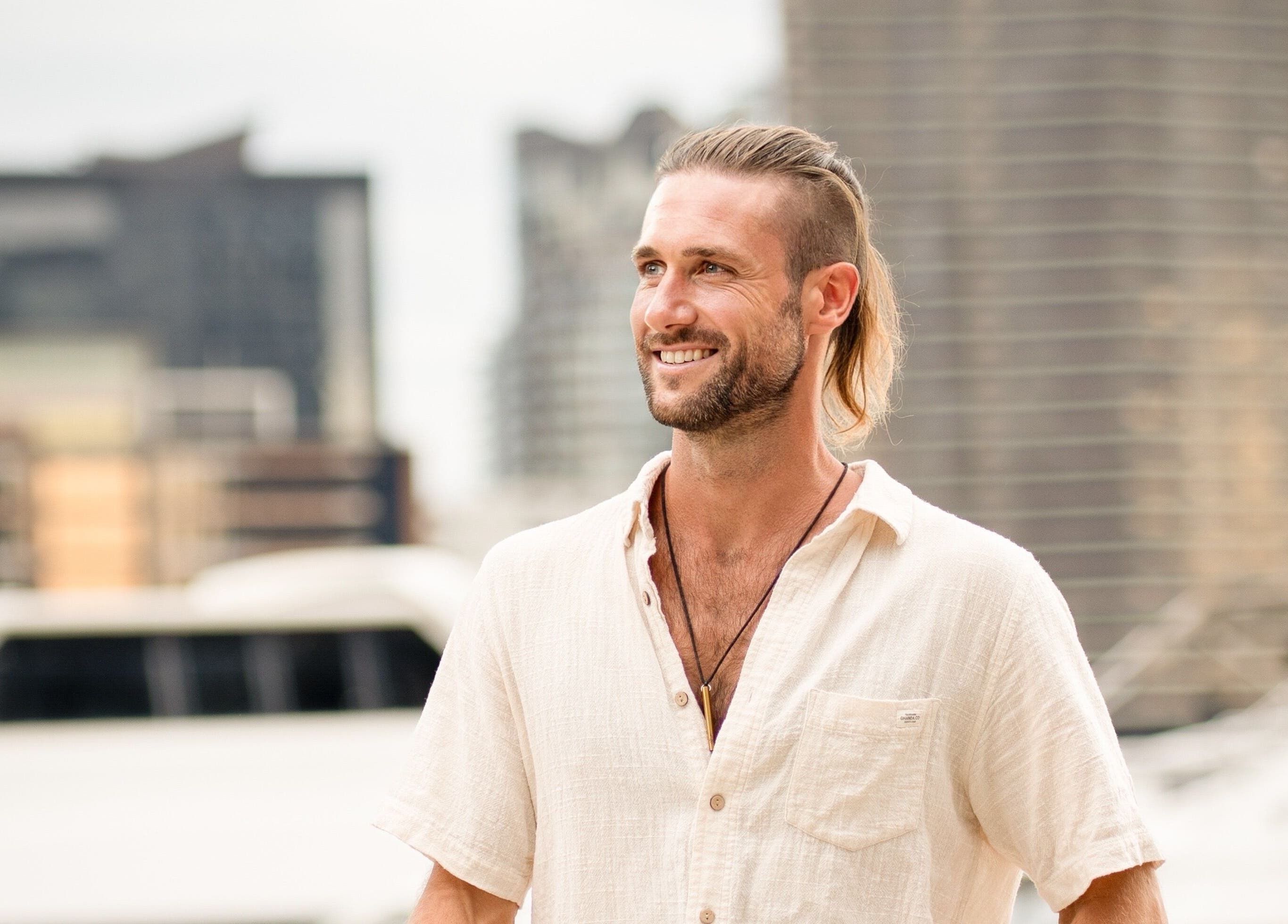 Smiling individual enjoying a relaxing moment at Byron Bay Home Massage in Suffolk Park, New South Wales, AU.