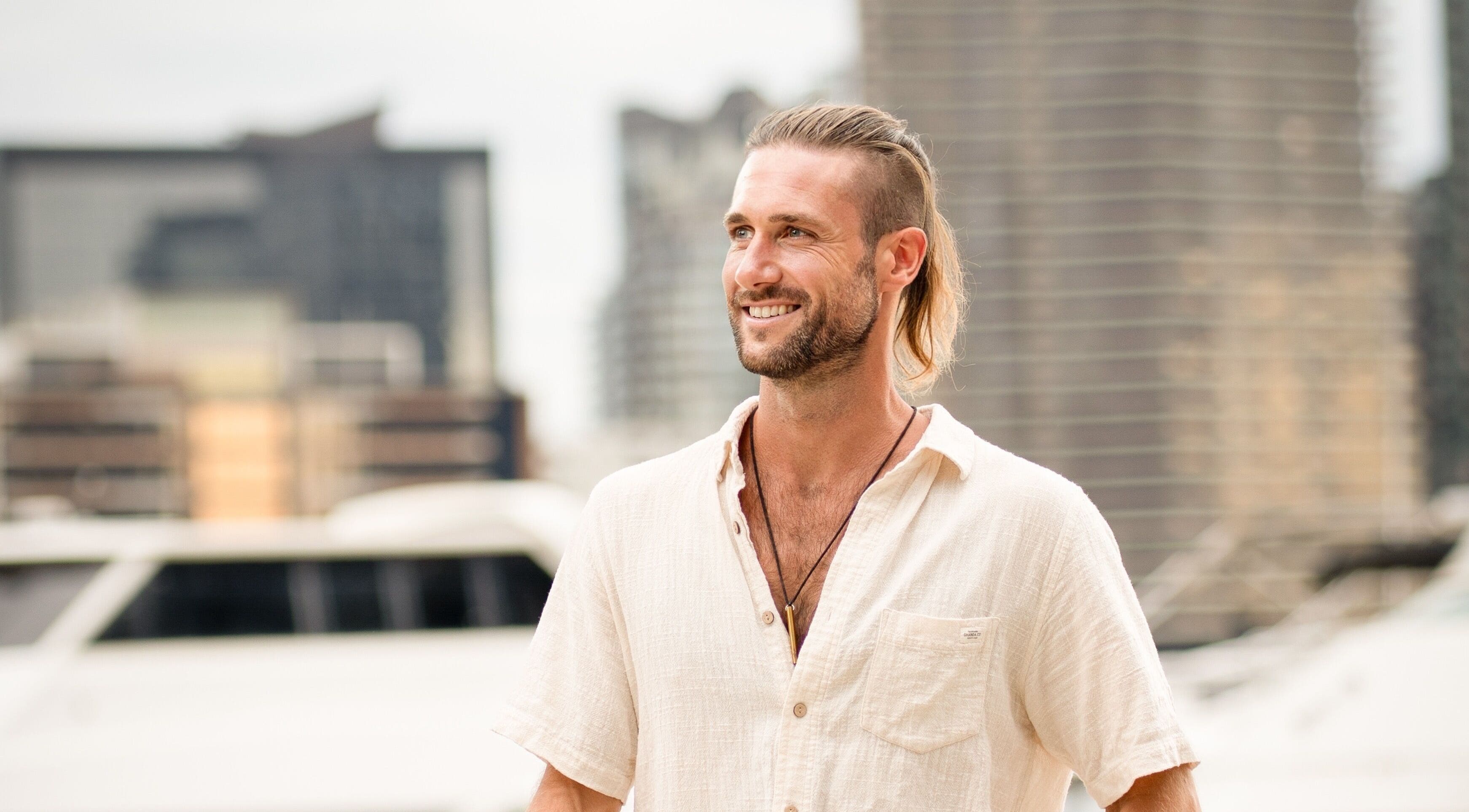 Smiling individual enjoying a relaxing moment at Byron Bay Home Massage in Suffolk Park, New South Wales, AU.