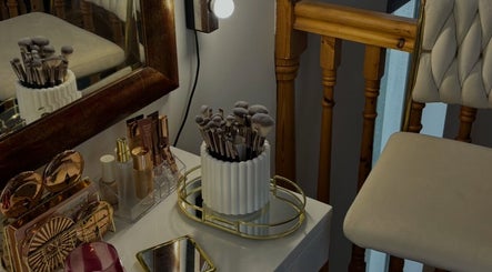 Makeup station at Réalta Studio, County Mayo, IE showcasing brushes and products on a stylish vanity table.