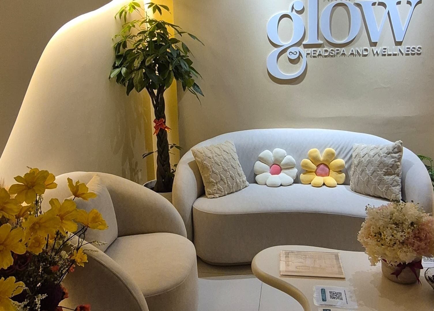 Cozy seating at Infinity Glow Headspa and Wellness in Petaling Jaya, Selangor, MY with floral accents.