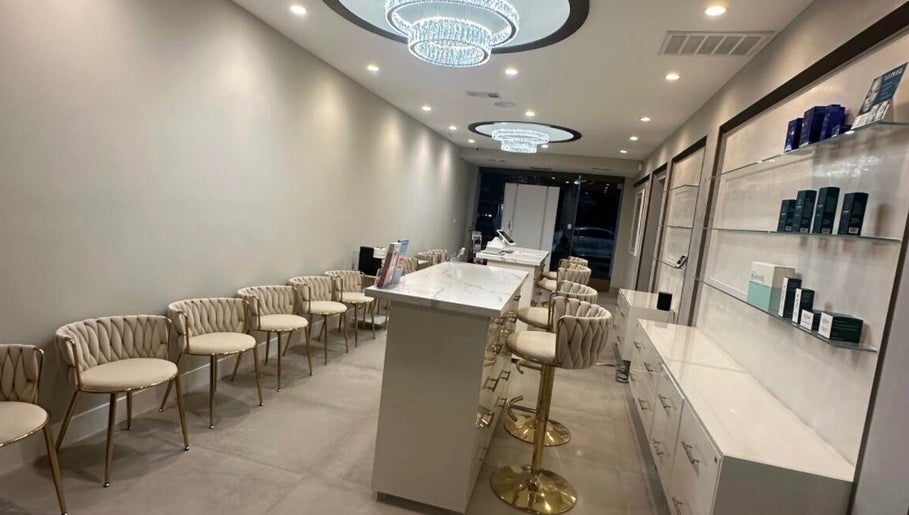 Chic interior of Skin Expert Aesthetics in Newport Beach, California, US, showcasing modern decor and seating.