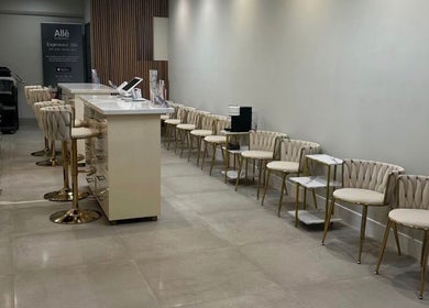 Chic lounge at Skin Expert Aesthetics in Newport Beach, California, US featuring plush seating and modern decor.