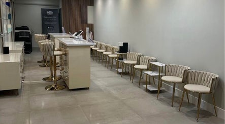Chic lounge at Skin Expert Aesthetics in Newport Beach, California, US featuring plush seating and modern decor.