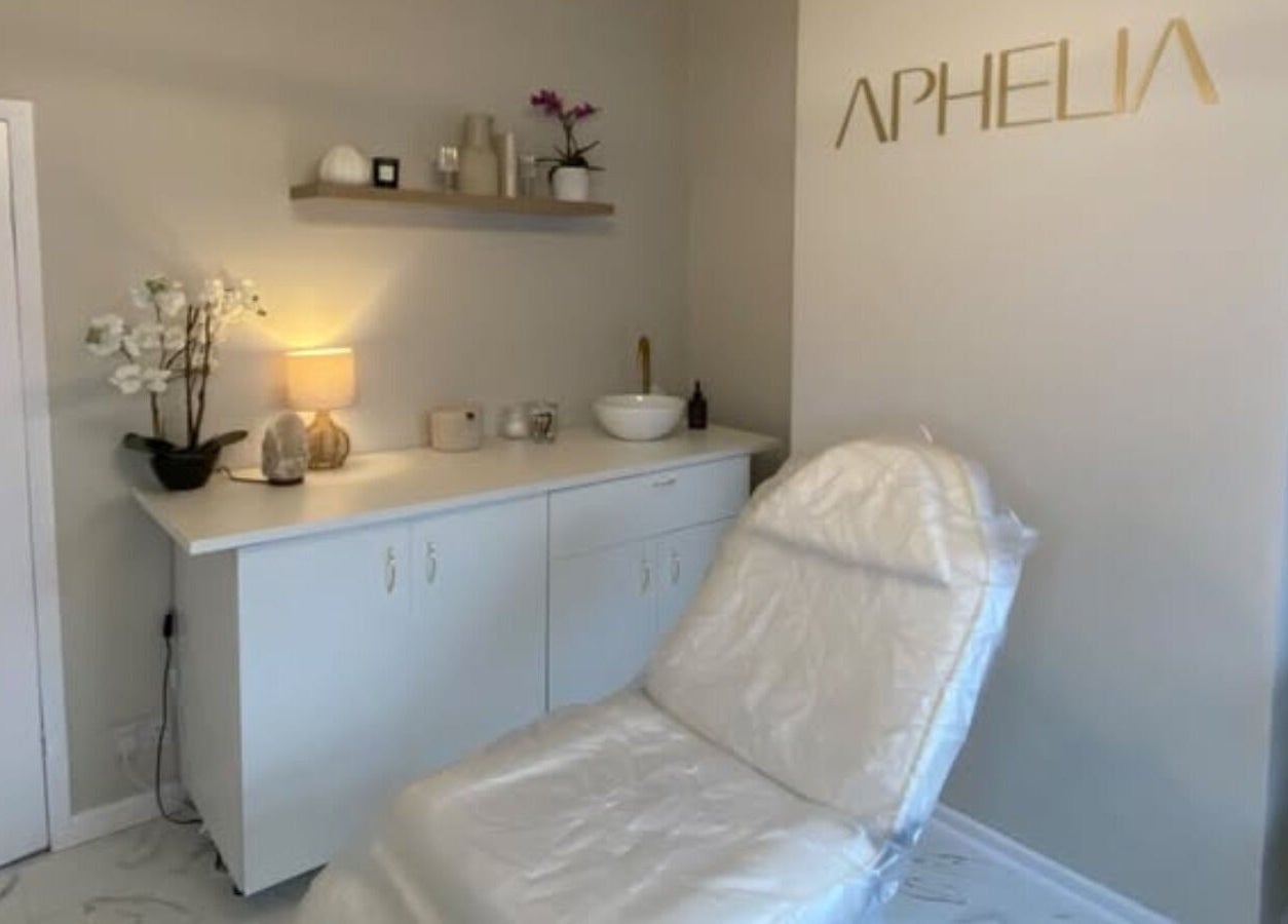Relaxing treatment room at Aphelia Aesthetics in Barrow Upon Soar, England, GB with a comfortable chair and elegant decor.