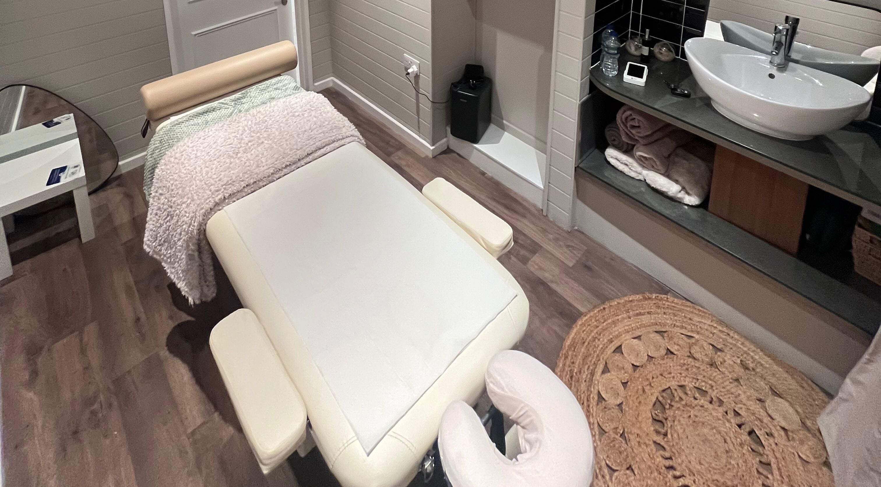 Massage room at Xela Massage and Recovery, Willerby, England, GB. Cozy setup with a plush massage table and warm decor.