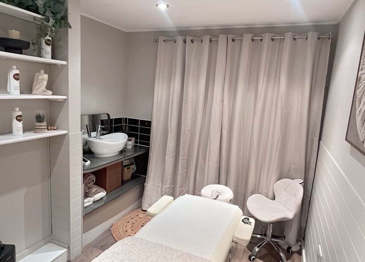 Relaxing massage room at Xela Massage and Recovery, Willerby, England, GB, featuring calming decor and massage table.