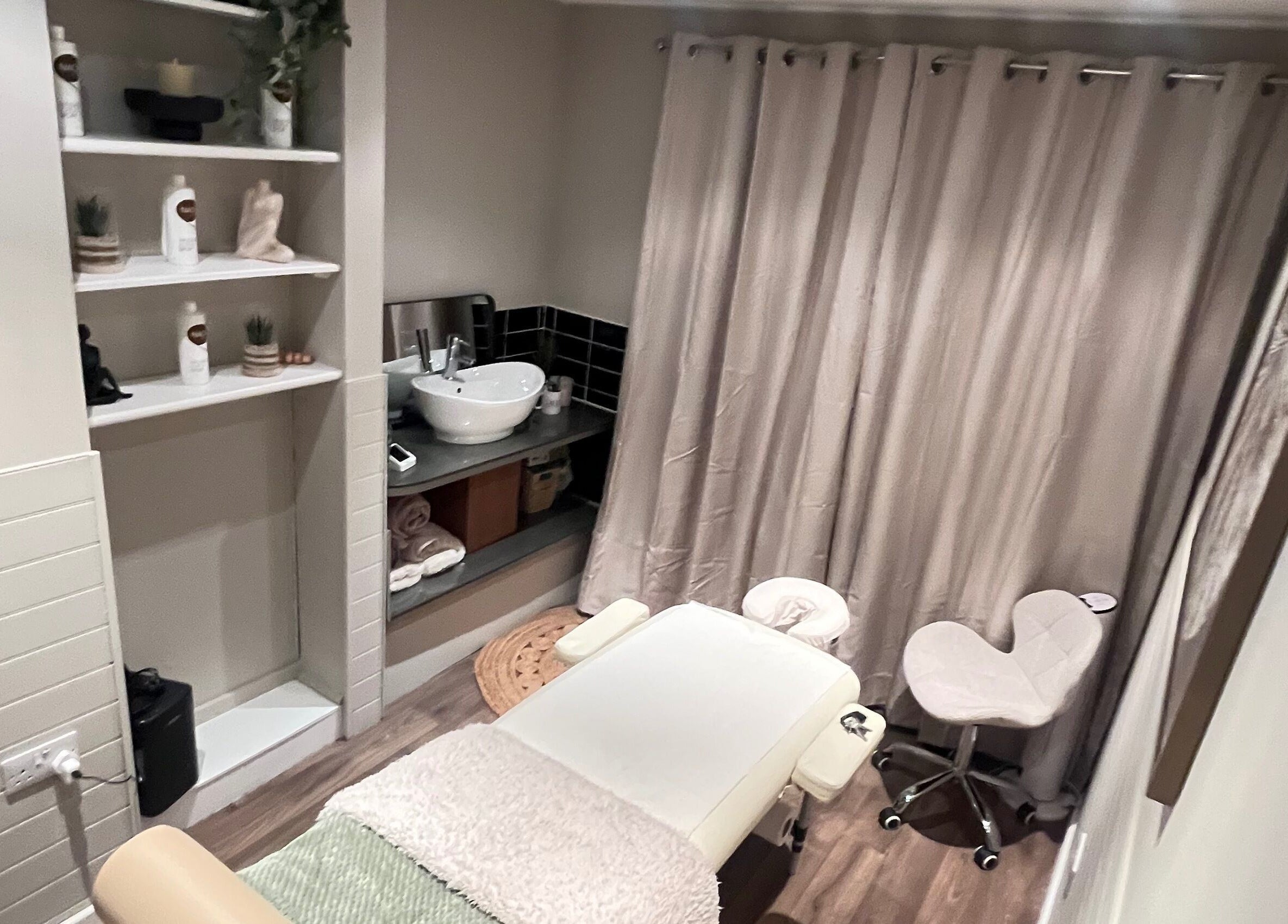 Cozy massage room at Xela Massage and Recovery, Willerby, England, GB, featuring a massage table and calming decor.