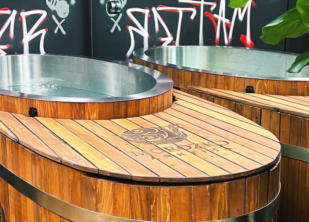 Wooden hot tubs at Transformation Columbus in Powell, Ohio, US offer a relaxing spa experience.