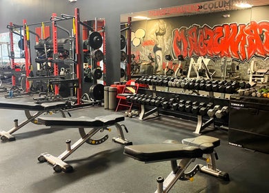 Gym equipment at Transformation Columbus in Powell, Ohio, US. Features benches and weights for a robust workout.