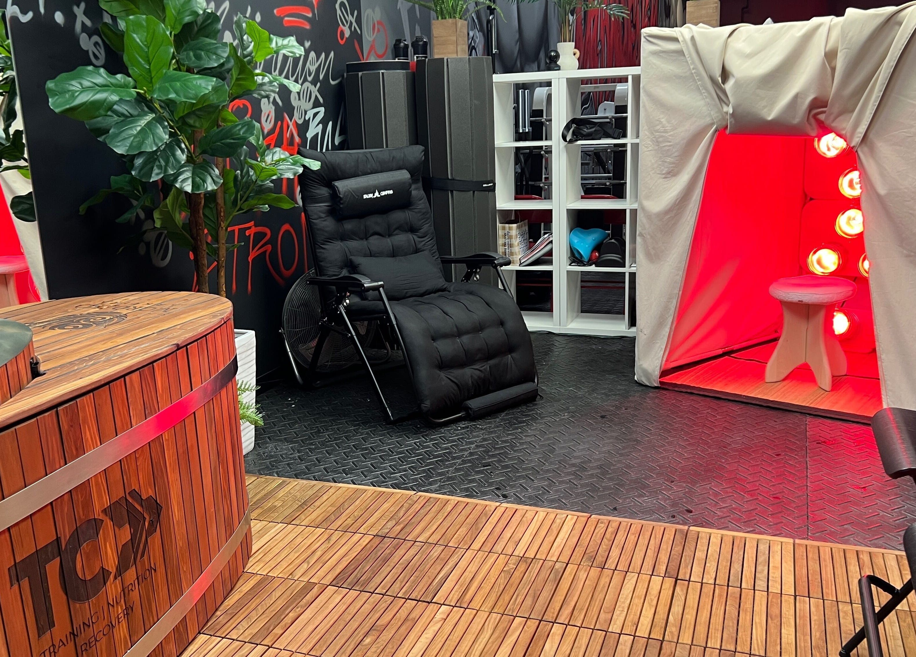 Relaxing wellness area at Transformation Columbus in Powell, Ohio, US with sauna, recliner, and plants.