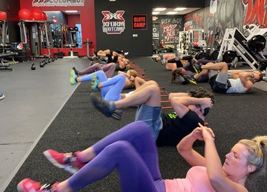 People exercising at Transformation Columbus gym in Powell, Ohio, US, enhancing wellness and fitness.