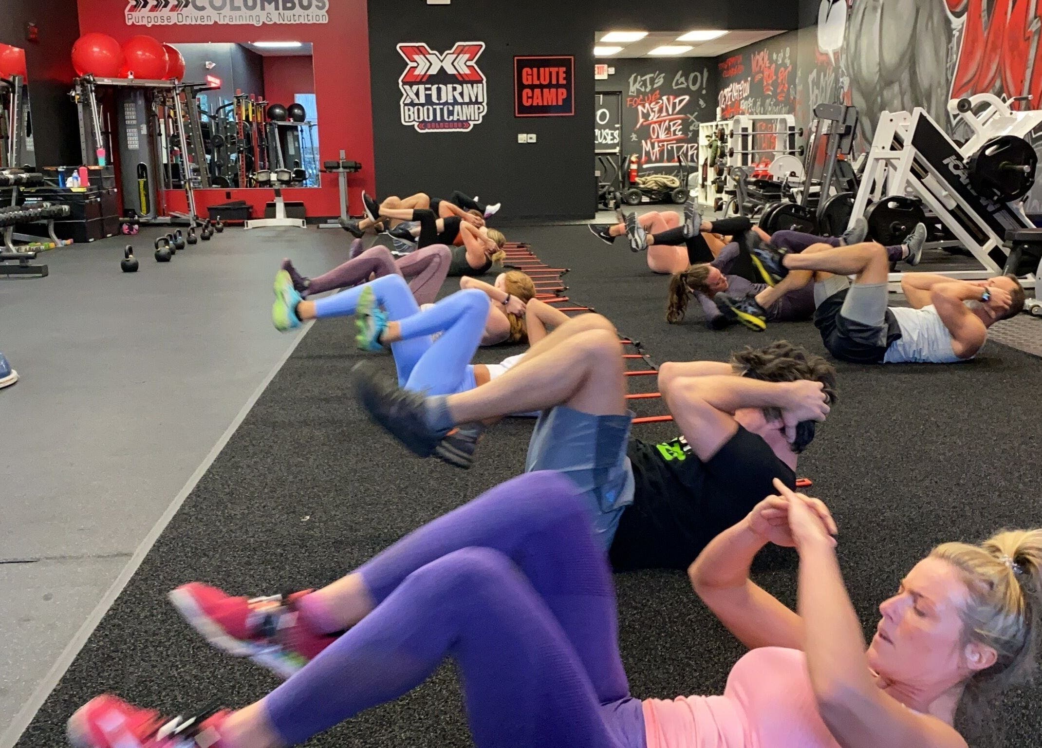 People exercising at Transformation Columbus gym in Powell, Ohio, US, enhancing wellness and fitness.
